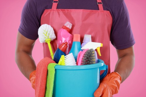 Professional cleaning technician working on an oven