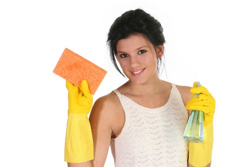 Technician using specialized oven cleaning tools